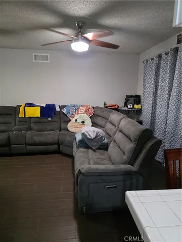 a bedroom with furniture and a chandelier