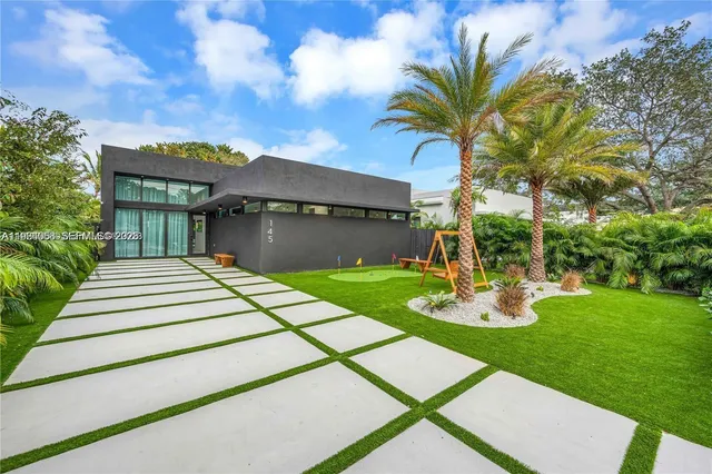 a front view of a house with garden