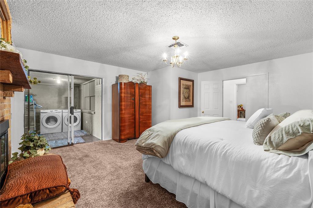 748 Rocky Ridge Lane Weatherford, TX 76085 - Photo 10 of 38 a spacious bedroom with a bed and ceiling fan