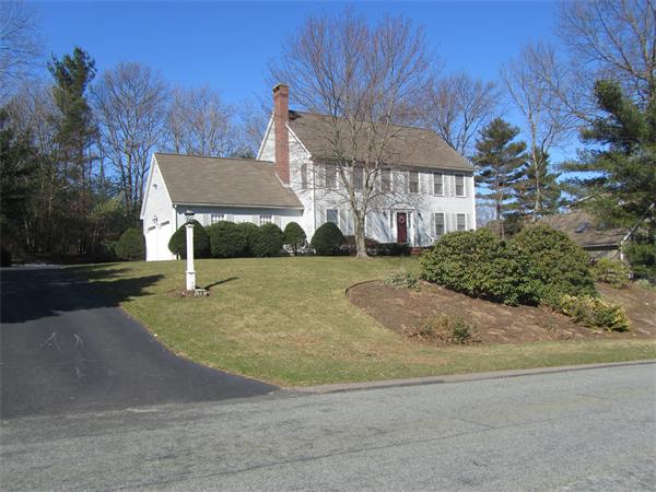 76 Emerson Road Walpole, MA 02032 - Photo 1 of 15 a view of a house with a yard and garage