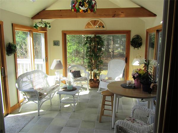 76 Emerson Road Walpole, MA 02032 - Photo 11 of 15 a living room with furniture and a floor to ceiling window