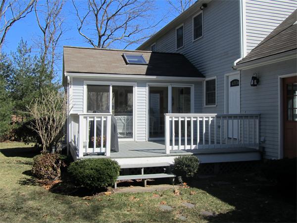 76 Emerson Road Walpole, MA 02032 - Photo 13 of 15 a view of a house with a bench in patio