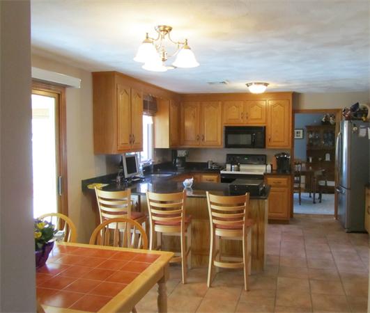 76 Emerson Road Walpole, MA 02032 - Photo 2 of 15 a view of a dining room with furniture