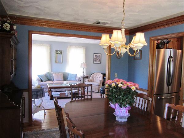 76 Emerson Road Walpole, MA 02032 - Photo 6 of 15 a dining room with furniture a chandelier and wooden floor