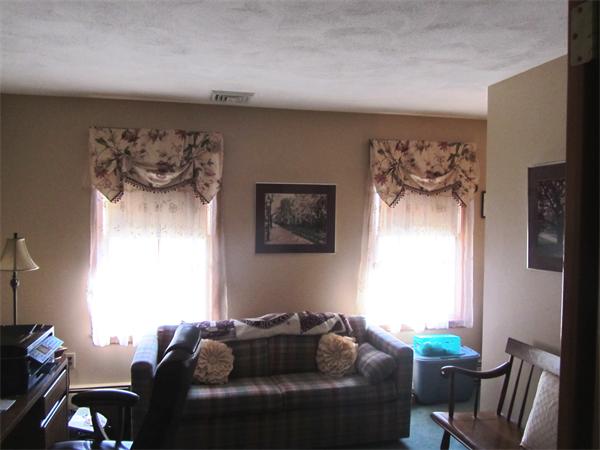 76 Emerson Road Walpole, MA 02032 - Photo 7 of 15 a living room with furniture and a window