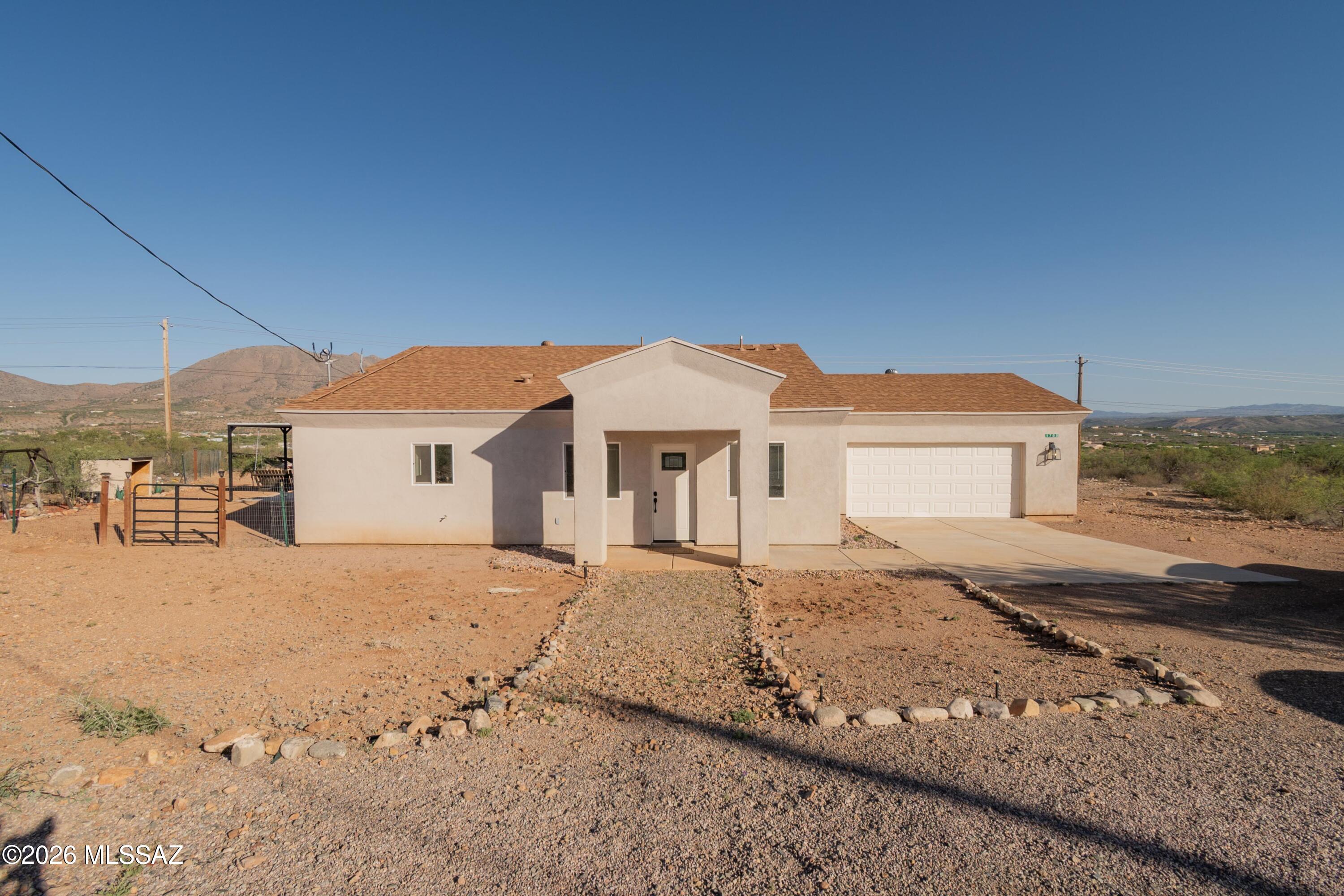 1785 Dove Court Rio Rico, AZ 85648 - Photo 2 of 31 a view of a house with a yard
