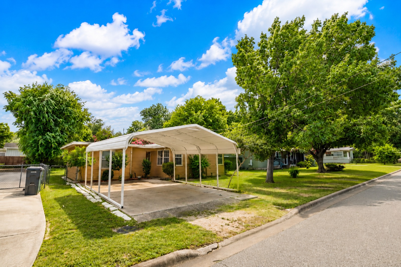 1508 Walnut Street Georgetown, TX 78626 - Photo 16 of 37 A welcoming street view highlights a cozy home with a practical carport and verdant surroundings.