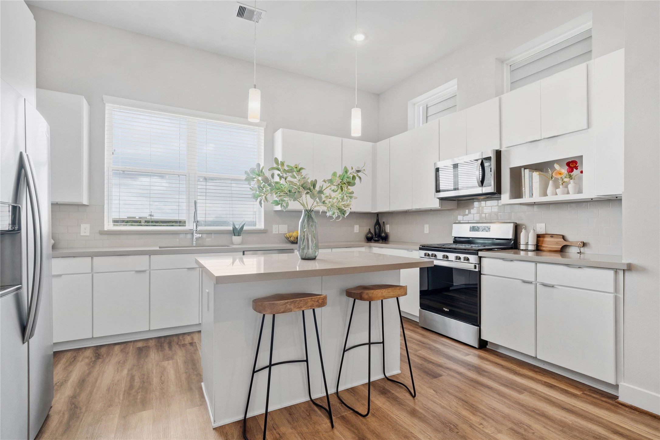 1284 North Post Oak Road, Unit B Houston, TX 77055 - Photo 1 of 37 Bright and airy kitchen with sleek design and abundant natural light.
Photos taken of home when it was fully staged.