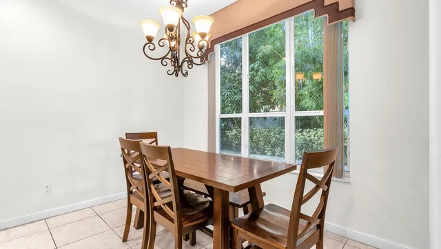 a kitchen with granite countertop cabinets a sink a counter and appliances