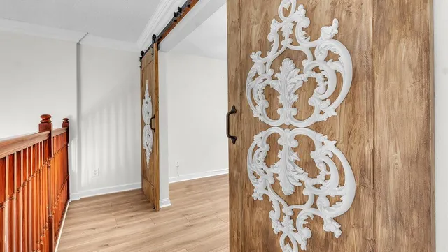 a view of a livingroom with wooden floor and window