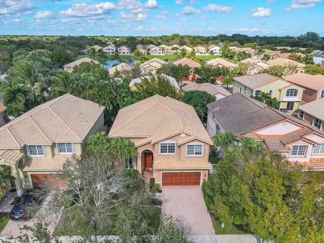 an aerial view of residential houses with outdoor space