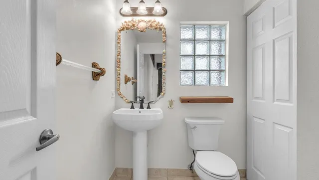 a view of a pathway with a garden