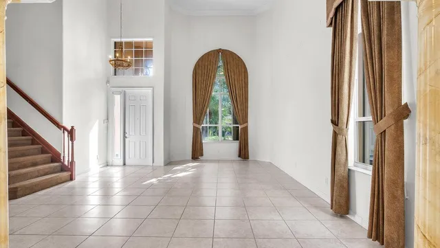 a view of an entryway with wooden floor and a window