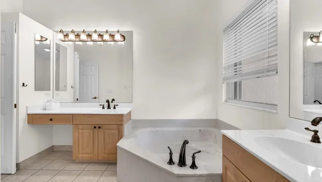 a kitchen with stainless steel appliances granite countertop a refrigerator and a stove