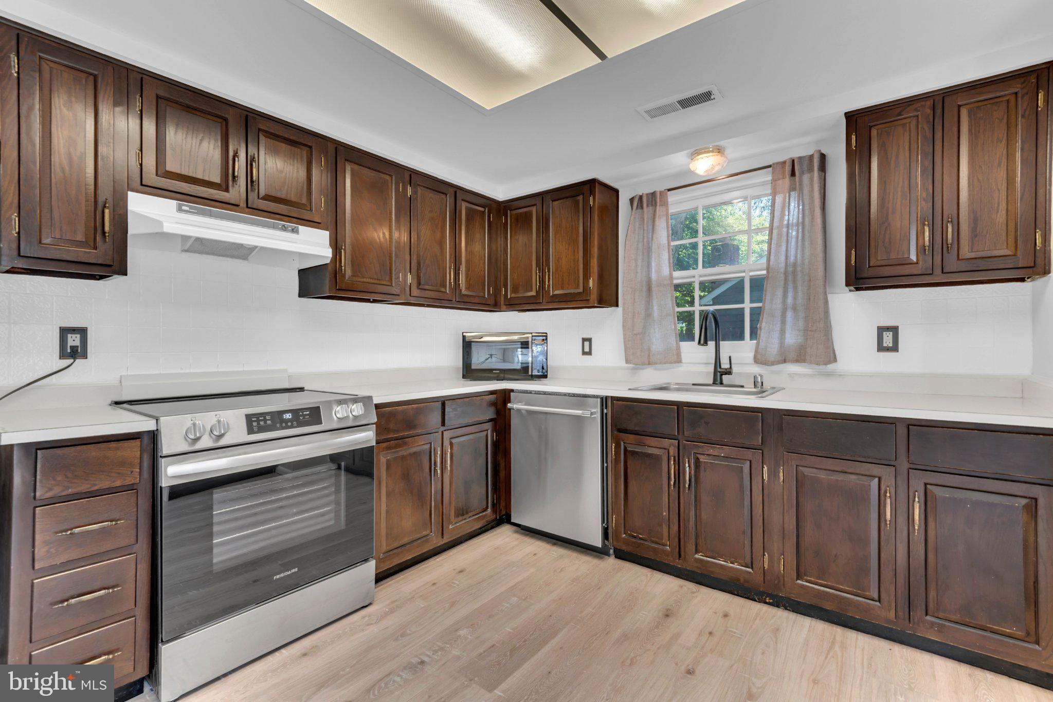 1836 Ralston Place Crofton, MD 21114 - Photo 10 of 42 Modern kitchen with rich cabinetry.