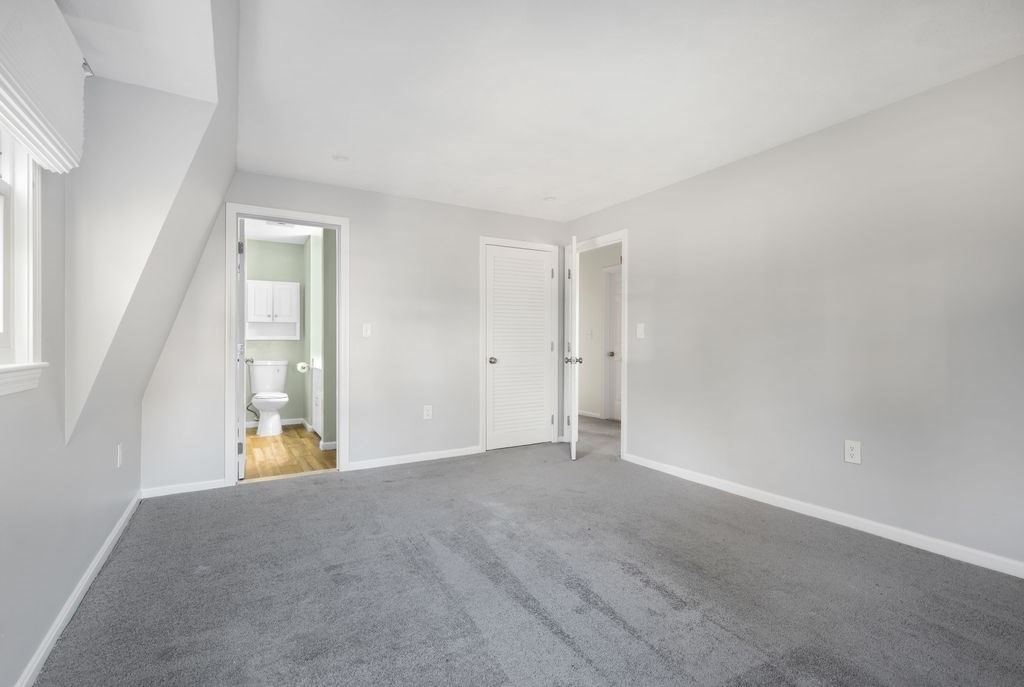 22 Browning Road Shrewsbury, MA 01545 - Photo 16 of 33 a view of an empty room with wooden floor and a window