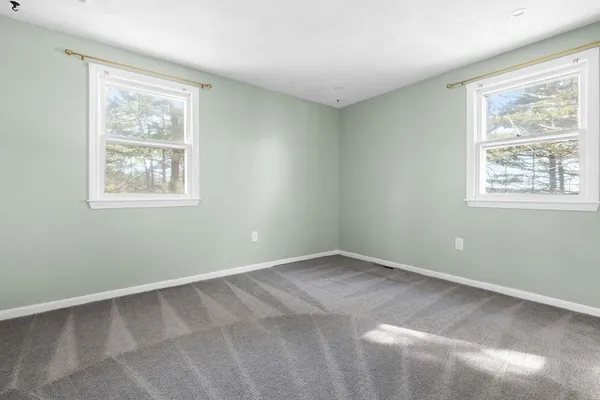 an empty room with closet area