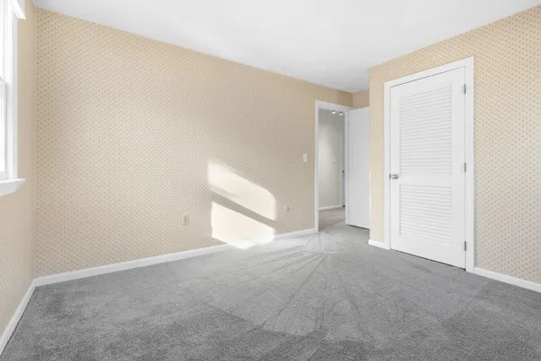 a bathroom with a toilet and a shower curtain