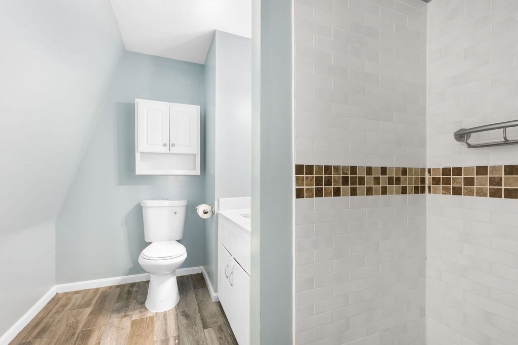 22 Browning Road Shrewsbury, MA 01545 - Photo 23 of 33 a bathroom with a toilet and a shower curtain