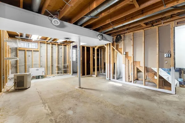 a view of a room with wooden ceiling