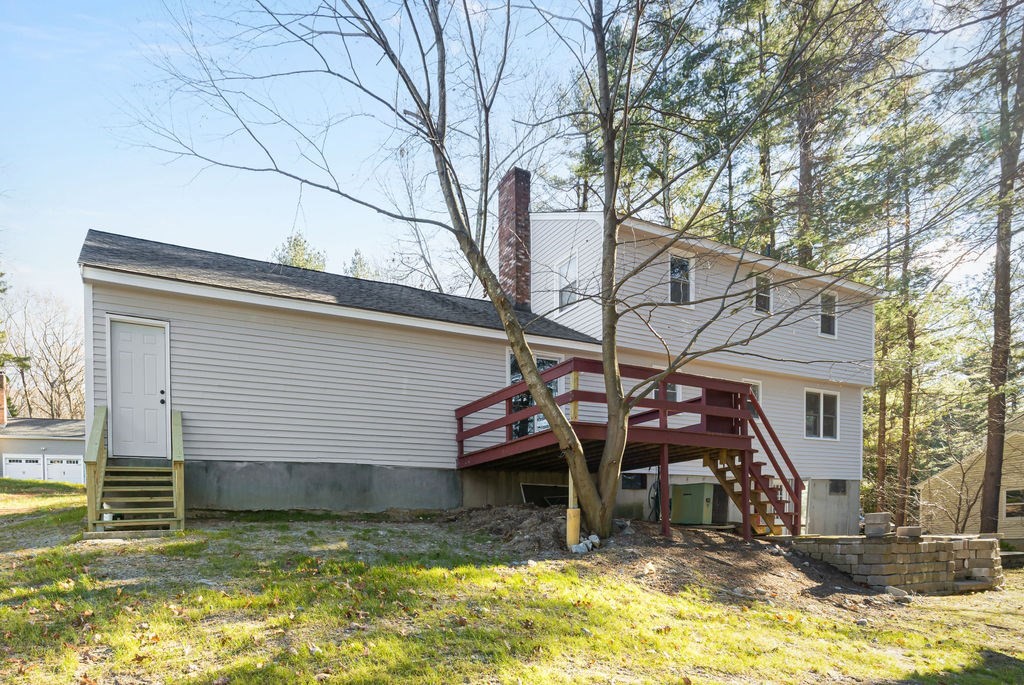 22 Browning Road Shrewsbury, MA 01545 - Photo 27 of 33 a view of a house with a yard chairs and floor to ceiling window