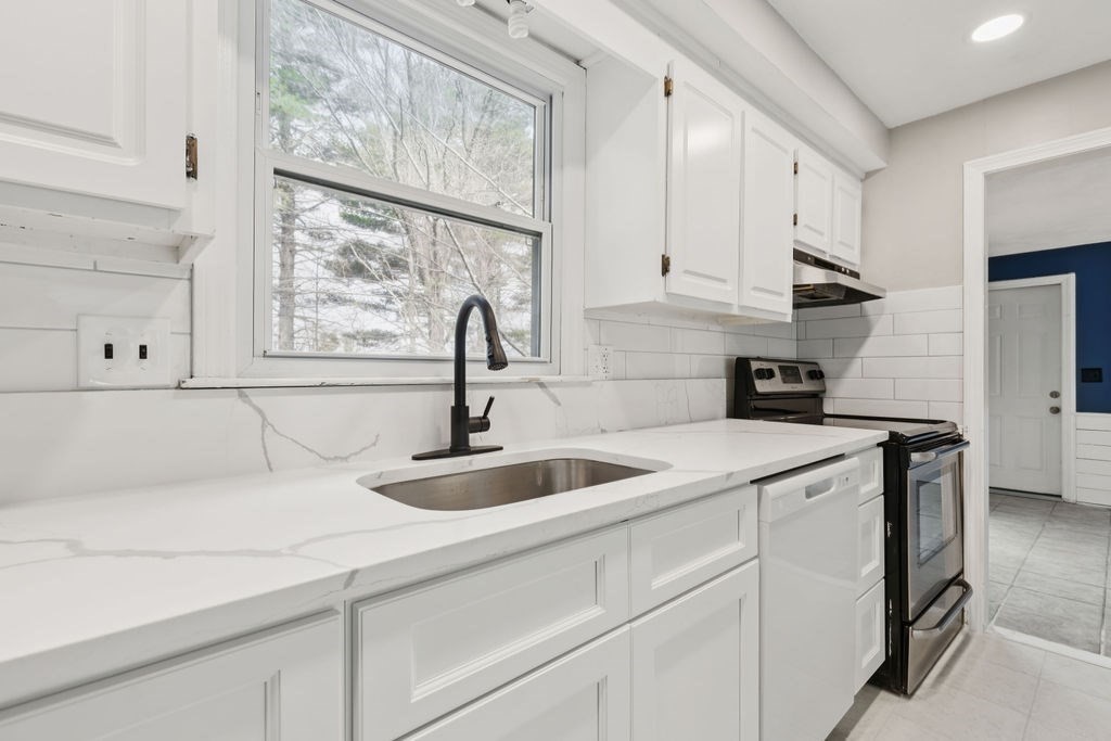 22 Browning Road Shrewsbury, MA 01545 - Photo 6 of 33 a kitchen with stainless steel appliances granite countertop a sink and a white cabinets