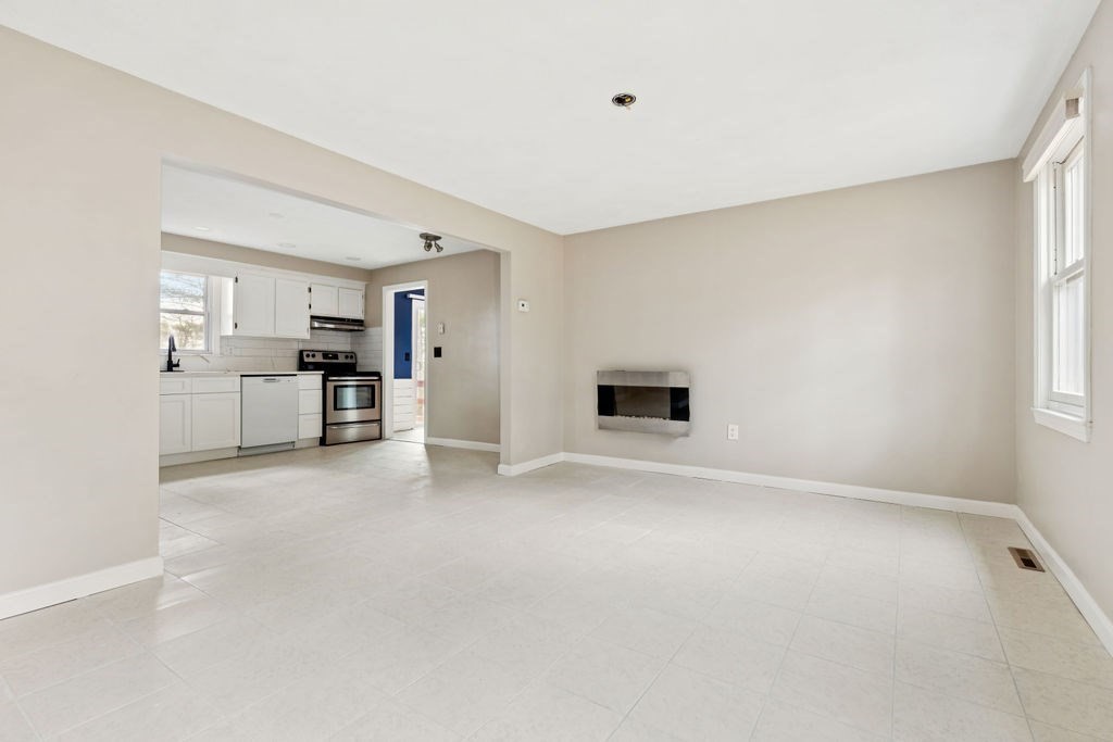 22 Browning Road Shrewsbury, MA 01545 - Photo 7 of 33 a view of a kitchen with a sink and a refrigerator