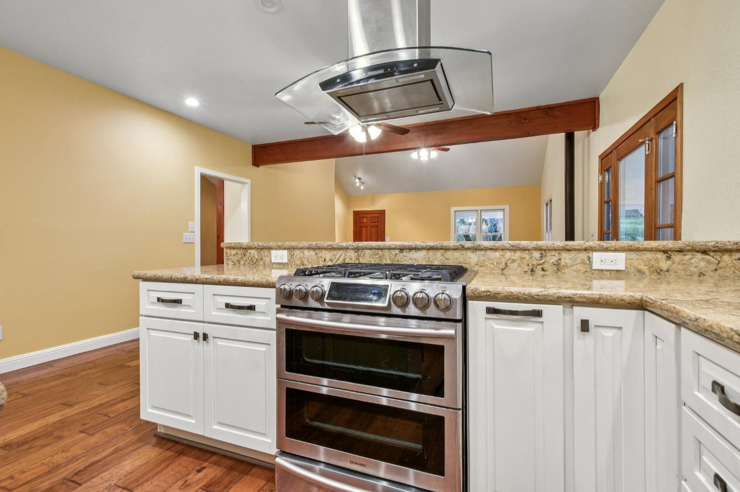 7650 Buzzards Gulch Road Somerset, CA 95684 - Photo 17 of 39 a kitchen with a stove and a sink
