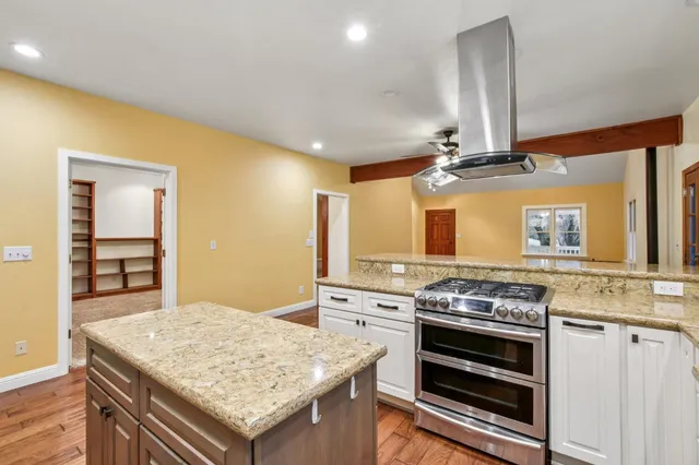 a kitchen with a stove and a sink