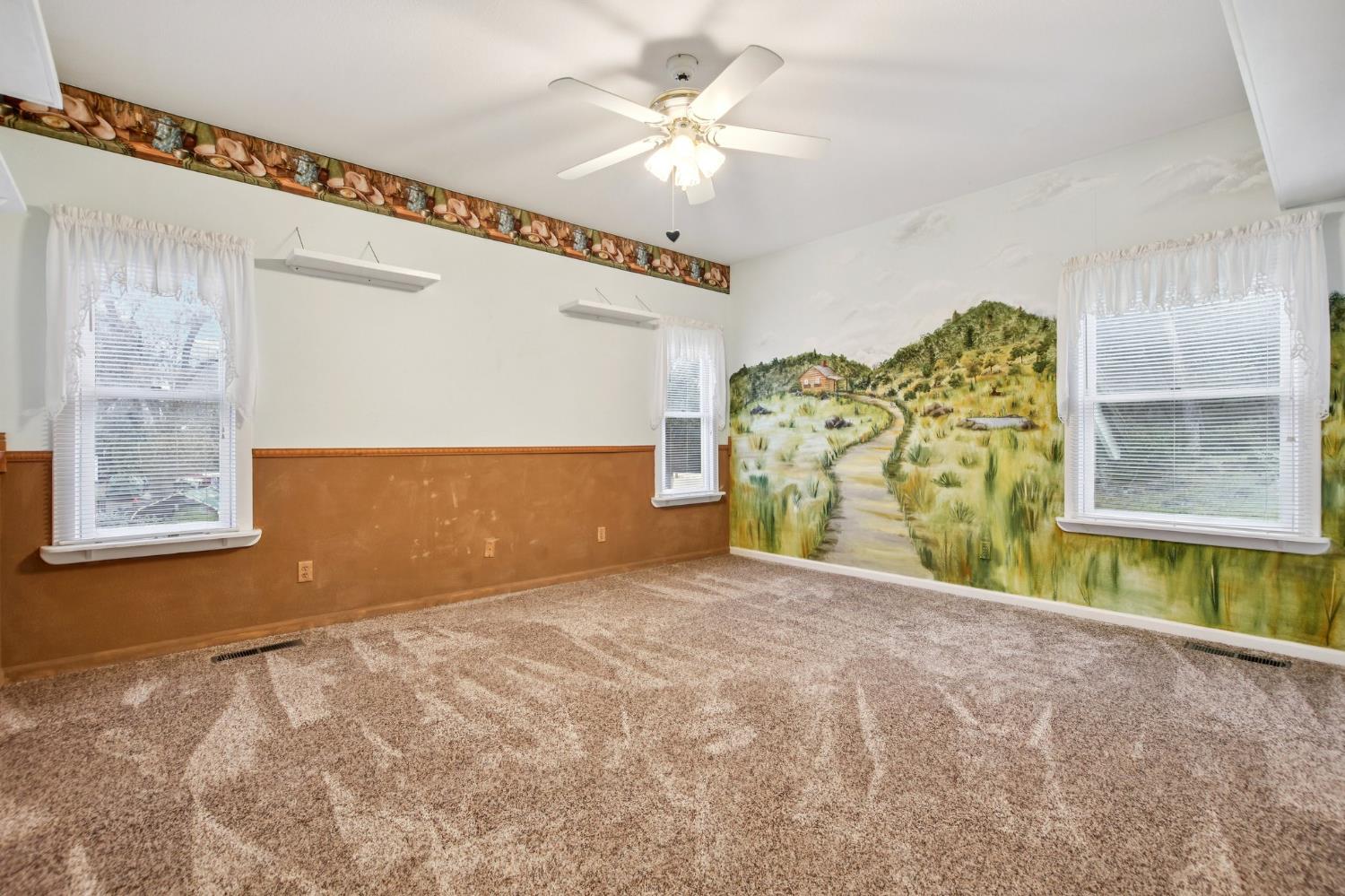 7650 Buzzards Gulch Road Somerset, CA 95684 - Photo 22 of 39 a view of a livingroom with a ceiling fan and window