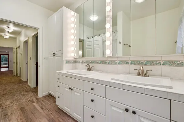 a bathroom with a sink and a mirror