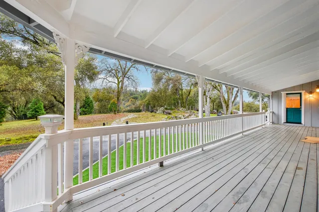 a view of balcony with wooden floor