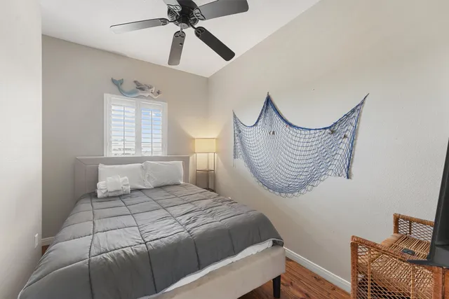 a bedroom with a bed chair and a window