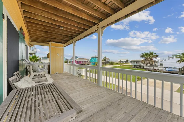 a view of balcony with furniture