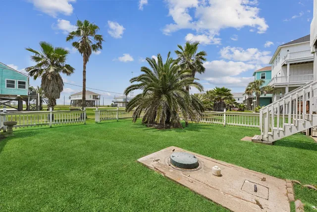a view of a garden with a building in the background