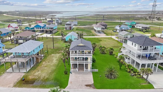 an aerial view of a house with a lake view