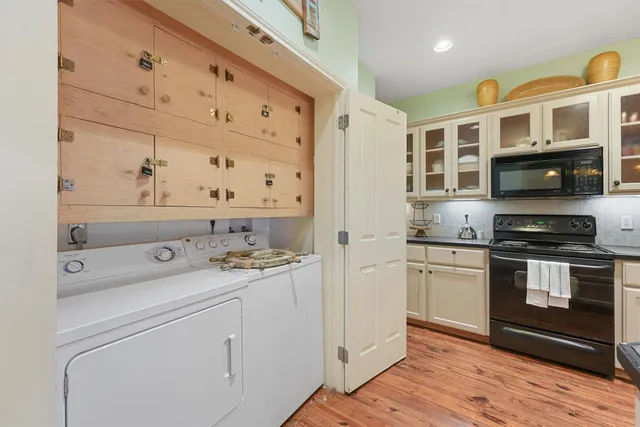 a kitchen with stainless steel appliances granite countertop a stove and a microwave
