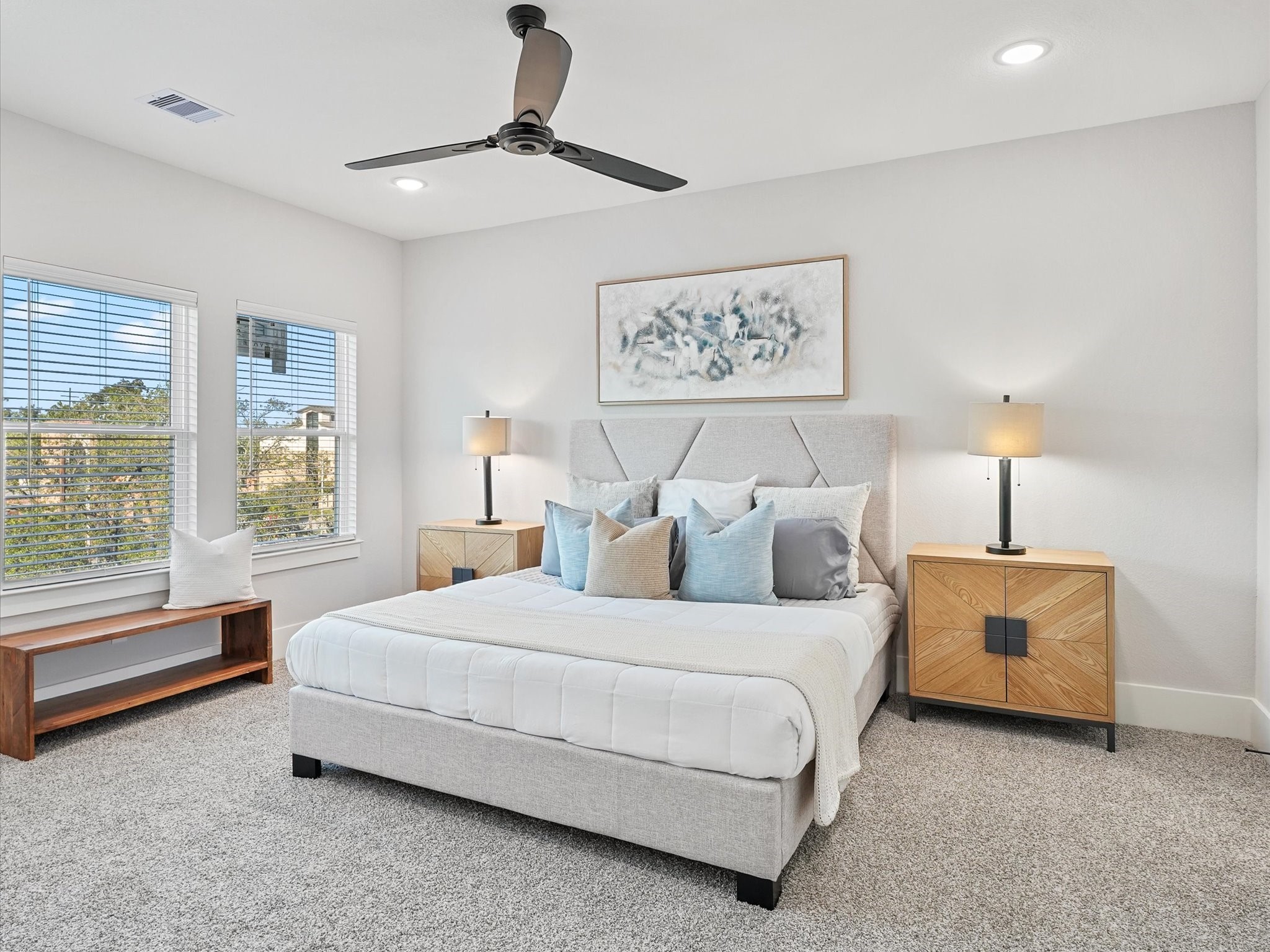 4812 Cochran Street Houston, TX 77009 - Photo 15 of 30 a bedroom with a bed painting on wall and a large window