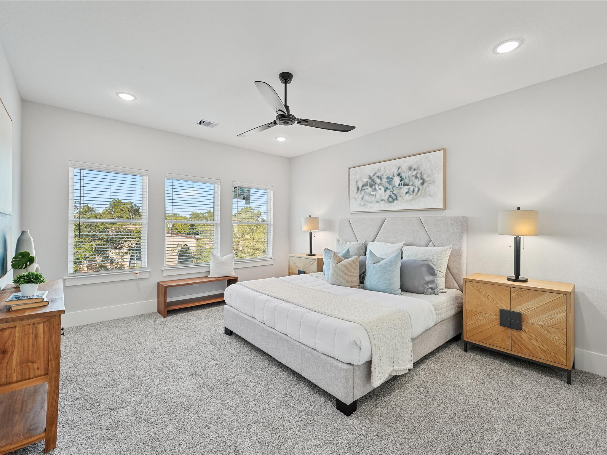 4812 Cochran Street Houston, TX 77009 - Photo 16 of 30 a bedroom with a large bed and a chandelier