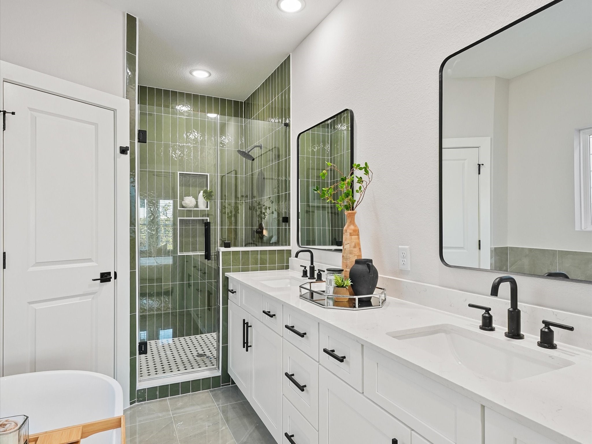 4812 Cochran Street Houston, TX 77009 - Photo 19 of 30 a bathroom with double vanity and a shower