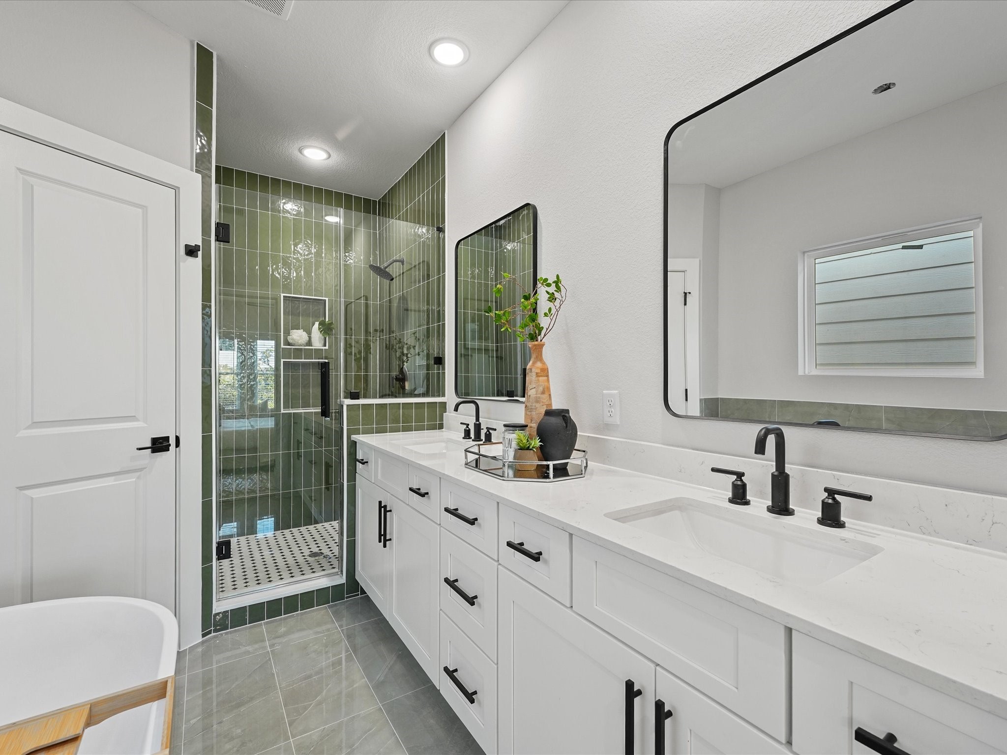 4812 Cochran Street Houston, TX 77009 - Photo 3 of 30 a bathroom with a double vanity sink toilet and shower