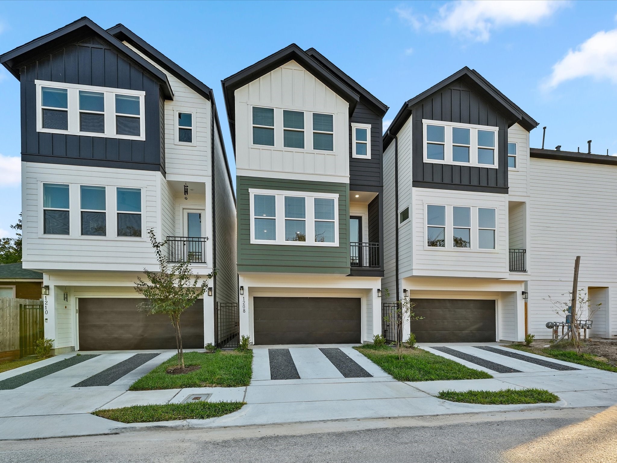 4812 Cochran Street Houston, TX 77009 - Photo 4 of 30 a front view of a house with a yard and garage