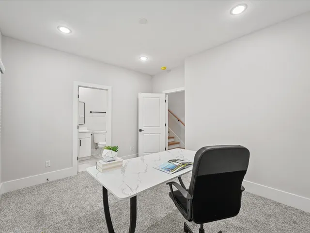 a workspace with furniture and bathroom