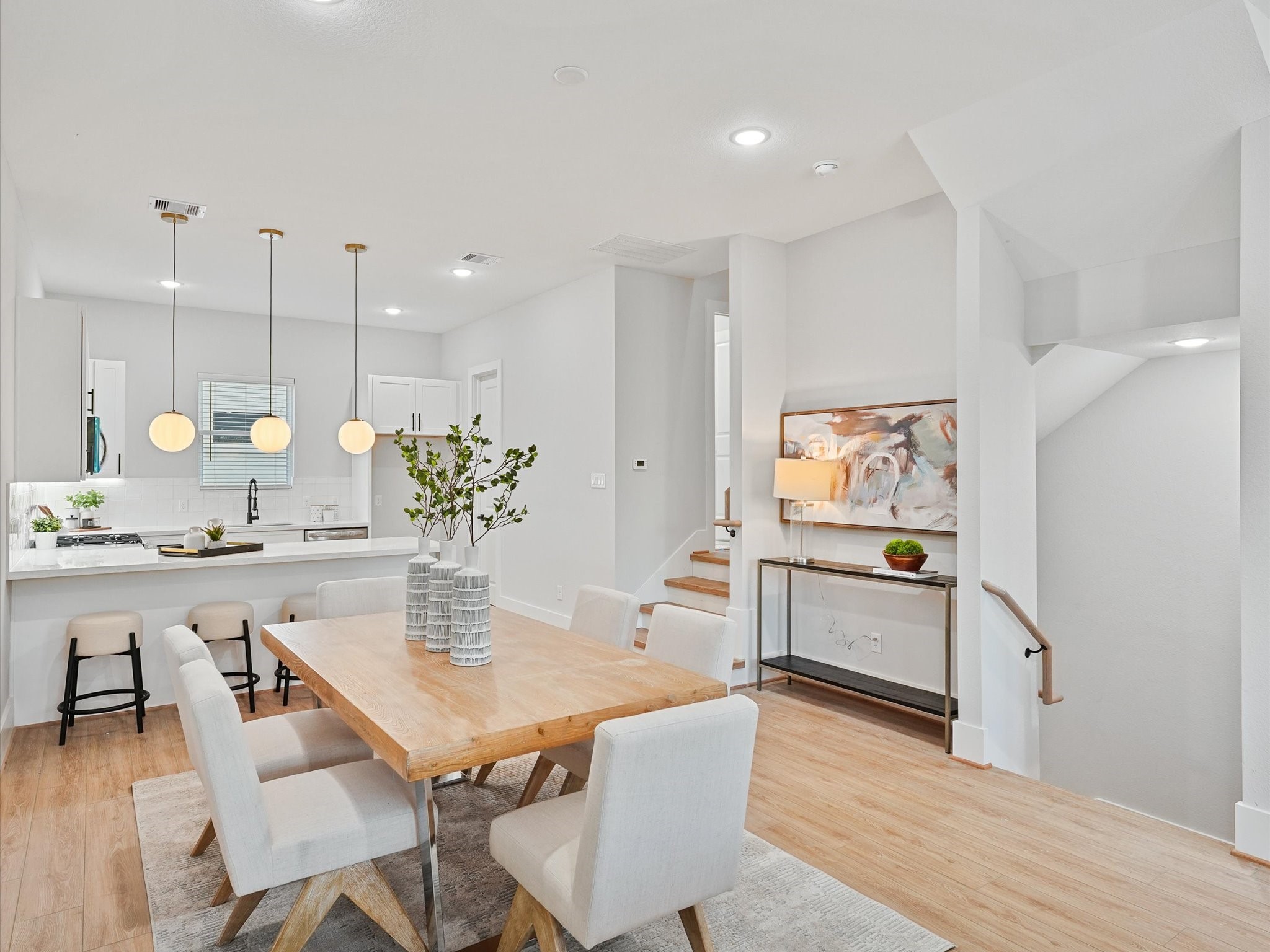 4812 Cochran Street Houston, TX 77009 - Photo 9 of 30 a kitchen with a table and chairs in it
