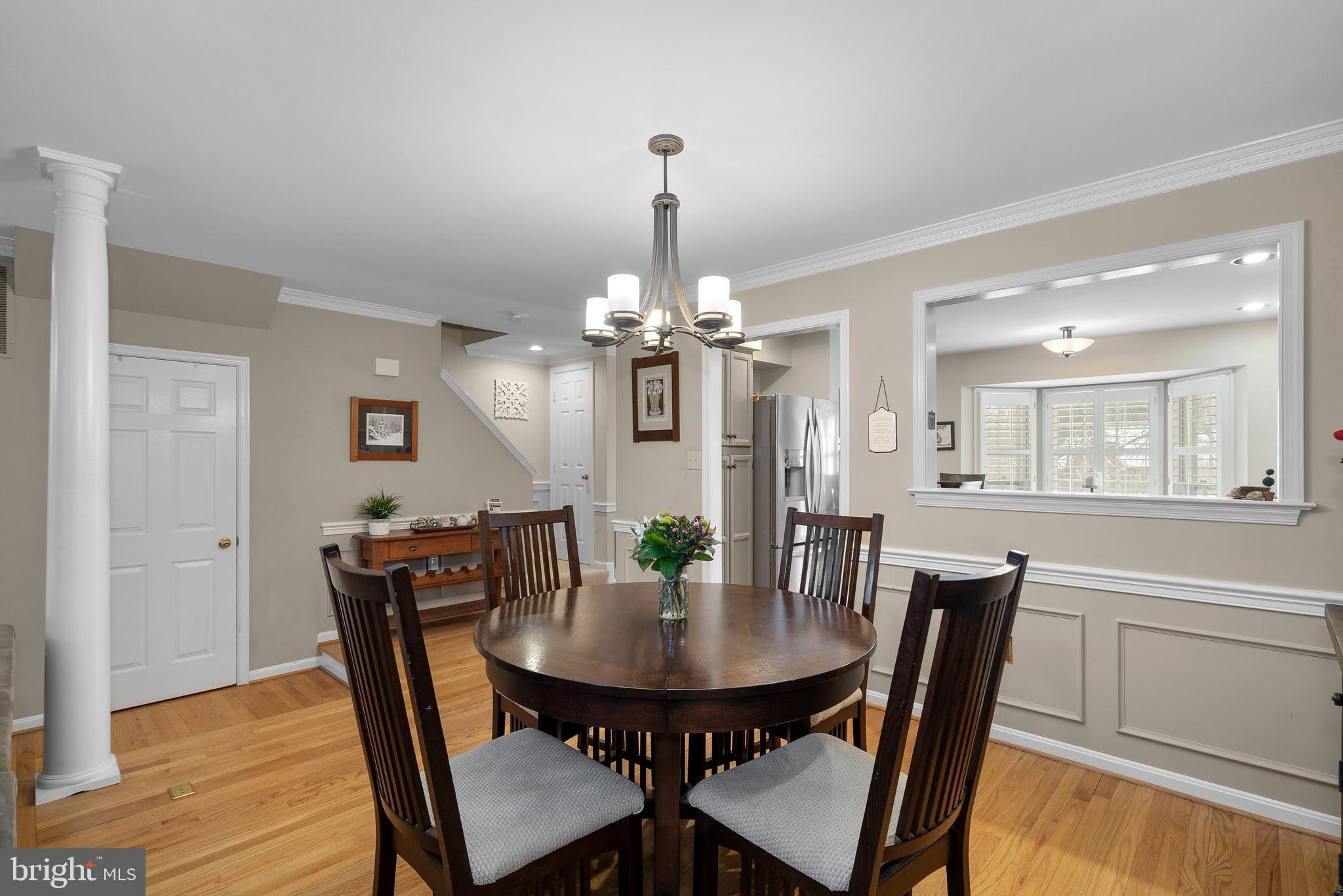 11713 Great Owl Circle Reston, VA 20194 - Photo 9 of 43 Dining Room w/ Shadowbox, Chair and Crown Molding