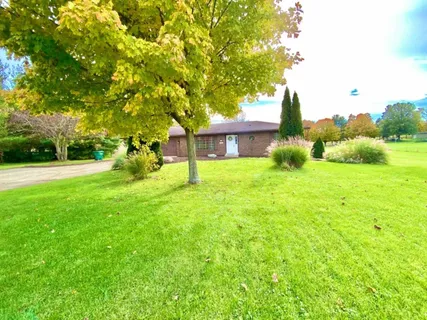 a view of a building and a yard