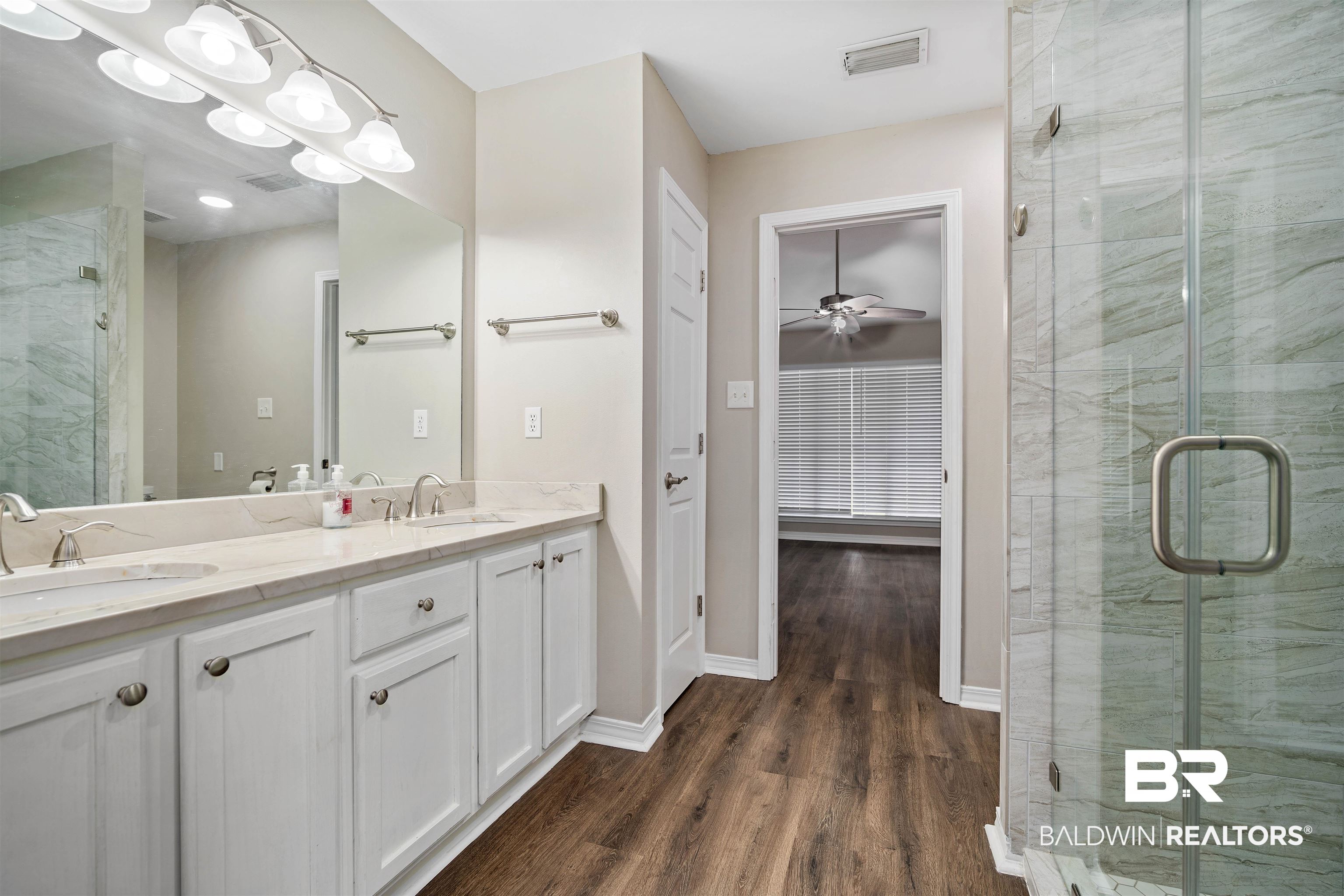 628 Spring Lake Court Mobile, AL 36695 - Photo 20 of 25 Bathroom featuring hardwood / wood-style flooring, vanity, ceiling fan, and walk in shower