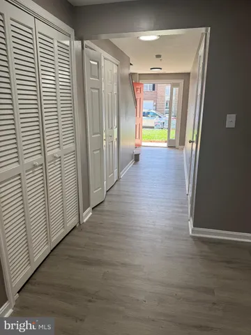 a kitchen with granite countertop wooden cabinets a sink and dishwasher