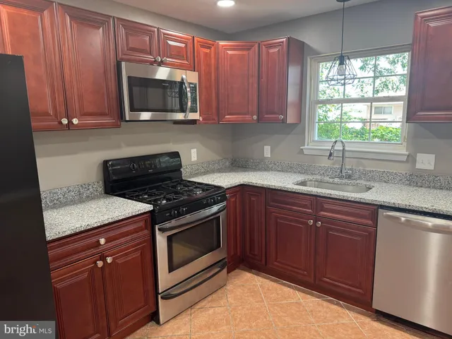 a bathroom with a toilet and a bathtub