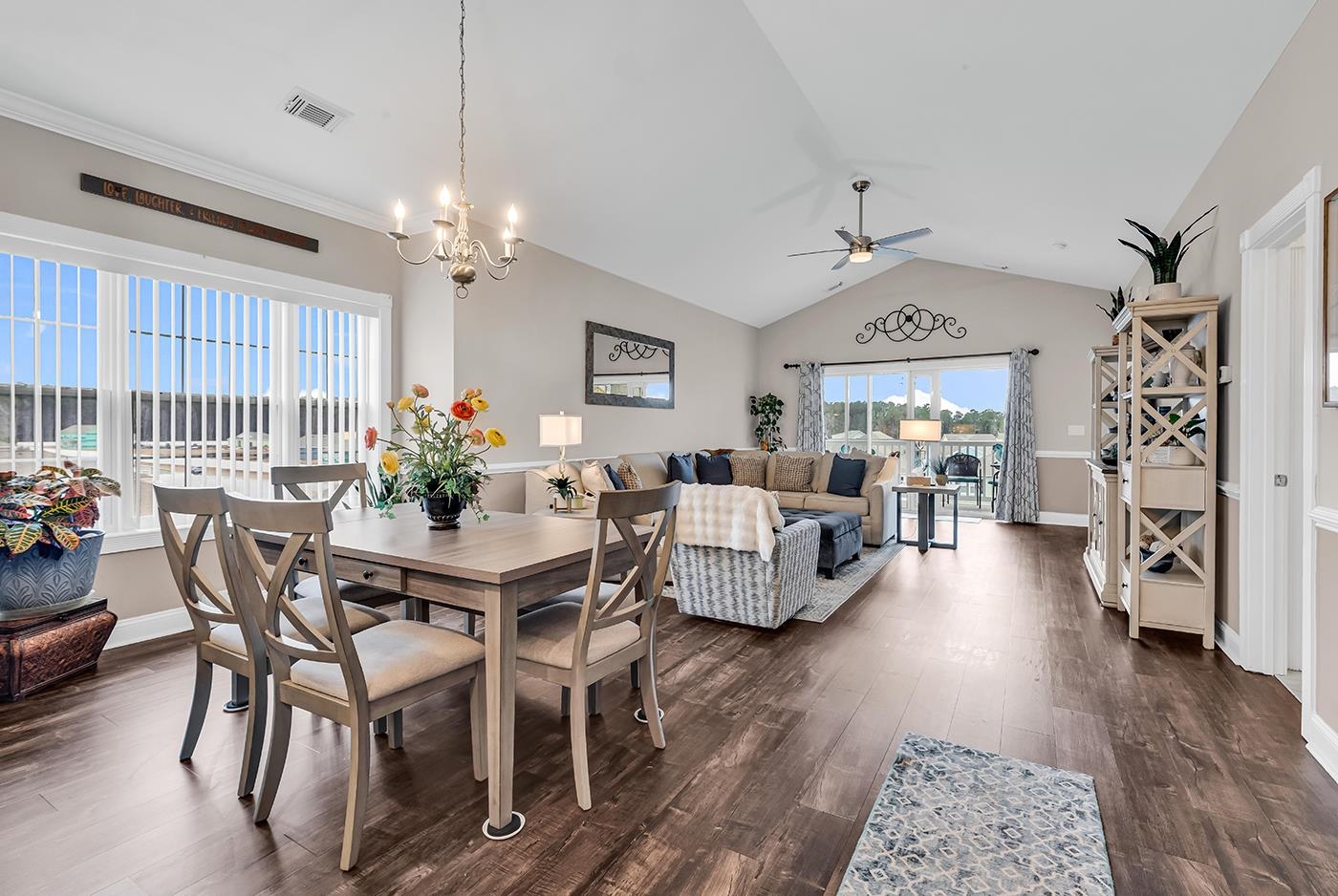 124 South Shore Boulevard, Unit 301 Longs, SC 29568 - Photo 2 of 27 Dining area with dark wood-type flooring, vaulted ceiling, a chandelier, and a ceiling fan